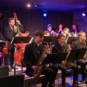 JMI Jazz Orchestra performing on stage at JMI Live